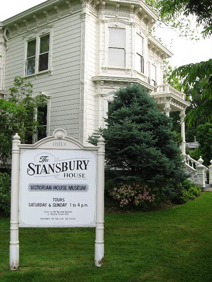 Photo of the old Stansbury House located in Oroville California. Sign states that tours are on Sat. & Sun. 1pm to 4 pm.